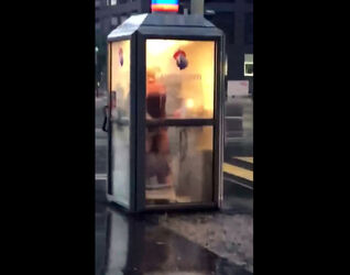 Brit duo smashes in telephone booth in center of city